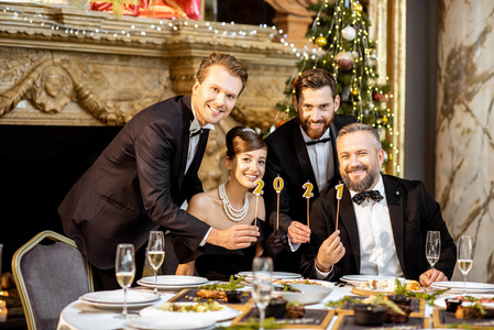 Elegant people celebrating New Year holiday