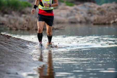 Trail running  moving on the water lakeside freedom 