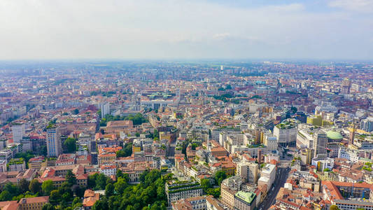 Milan, Italy. Roofs of the city aerial view. Cloudy weather, Aer