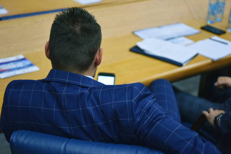 Businesspeople during business conference in conference room or 