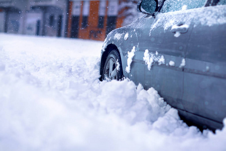 Winter problems of car drivers. Car on a snowy road. car stuck i