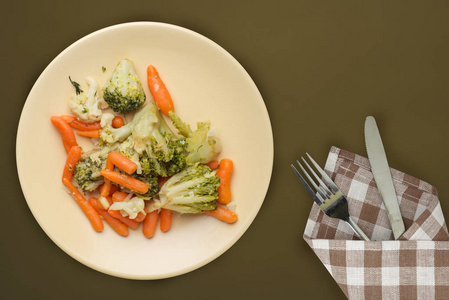  Provencal vegetables on a plate. fried vegetables on a beige  p