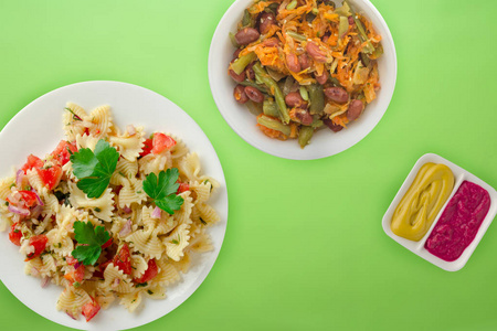 pasta on a white plate with vegetables. Mediterranean food with 