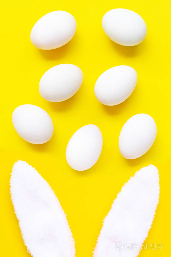 Fresh eggs on yellow background. 