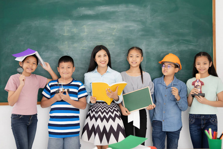  Asian students standing in classroom.