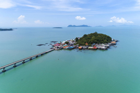 Beautiful small island in tropical sea with small bridge 