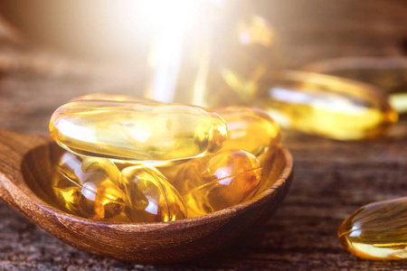 Close up the vitamin D and Omega 3 fish oil capsules supplement 