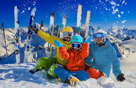 Happy family enjoying winter vacations in mountains . Ski, Sun, 