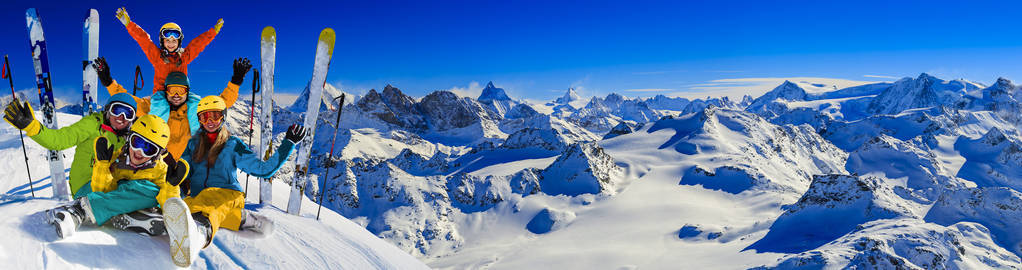 Happy family enjoying winter vacations in mountains . Ski, Sun, 