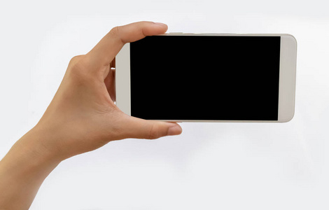 一只手拿着一部白色手机的黑色屏幕