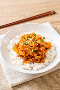 stirfried pork with kimchi on topped rice 