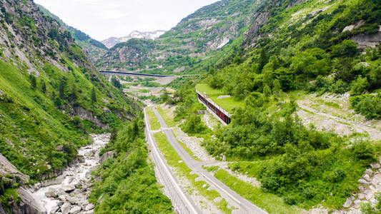 Switzerland. Picturesque winding mountain road with tunnels Gott