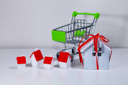 Shopping cart and houses. 