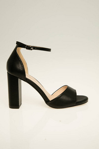Elegant black heels with pencil heel and white background