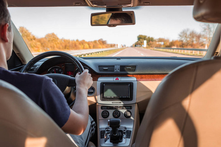 The man driving the modern car 