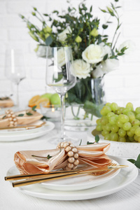 Elegant table setting with festive decoration in restaurant