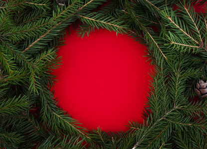  Christmas wreath over red background.