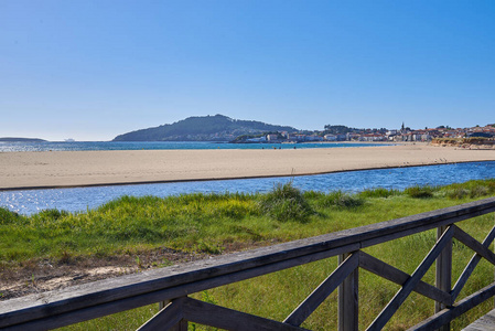 End of a river at Playa America beach in Vigo