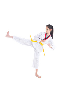 Young asian girl having taekwondo training ,one girl kicking 