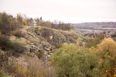 Beautiful autumn landscape. Rocky ledges, trees with colorful le