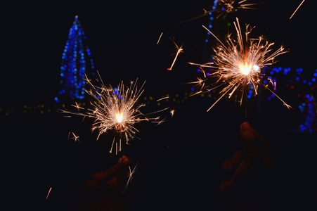 Close up of man hands holding sparkler,diwali lighting,festival 