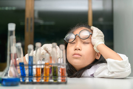 cute chemistry students sleeping after doing science experiment 