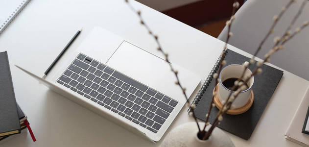 Top view of comfortable workspace with laptop computer and offic