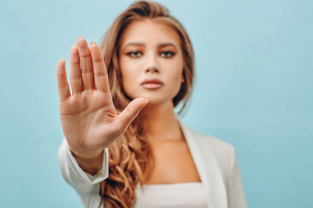 beautiful blonde girl on a blue background 