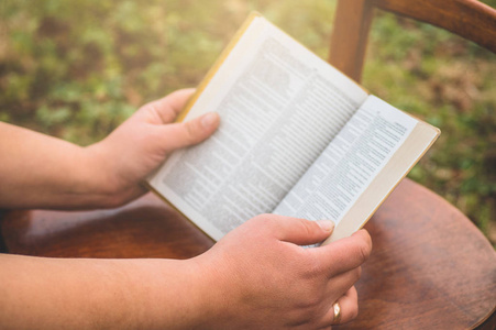 A woman is reading bible. Concept for faith, spirituality and re