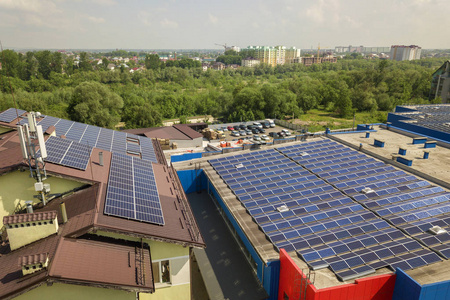 Aerial view of many solar panels mounted of industrial building 