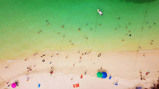 Aerial view of beach at Koh Khai, a small island, with crowd of 