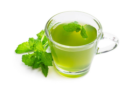 Green mint tea in clear glass cup isolated on white 