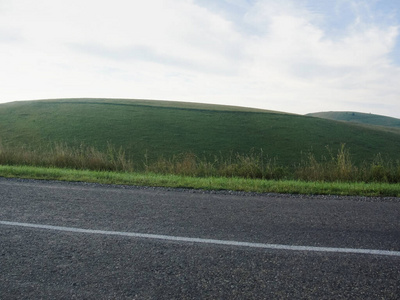 Empty Road with Nature in countryside with green hills