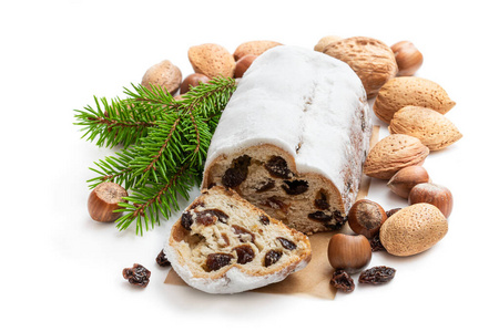Traditional Christmas stollen fruit cake isolated on white 