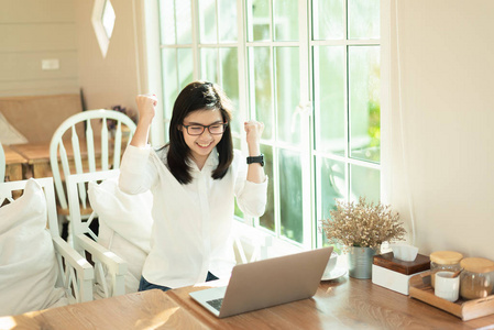 working women working with laptop and happy with the succession 