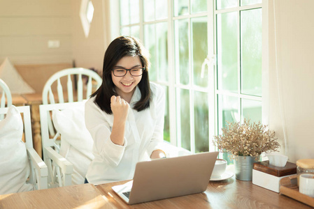 working women working with laptop and happy with the succession 