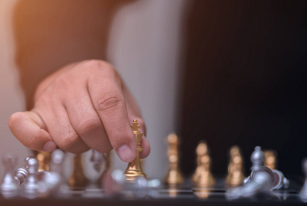 Business man holding golden king chess 