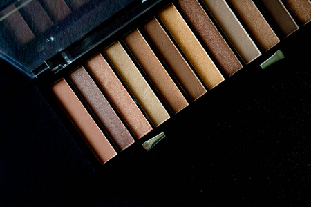 Cosmetic eye shadows black background. 