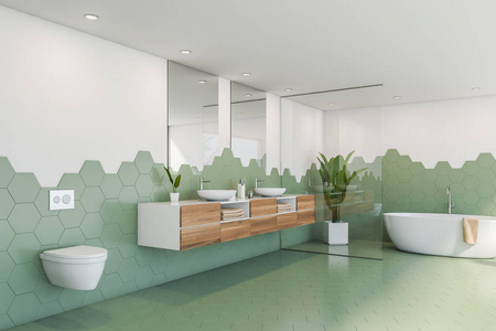 绿色和白色瓷砖浴室角落，浴缸和水槽