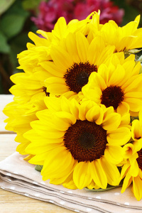 Bouquet of sunflowers on wooden table. 