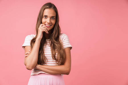 Image of pleased beautiful girl wearing striped clothes smiling 