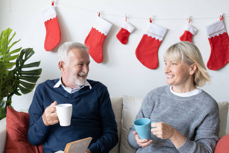 senior elderly caucasian old man and woman drinking coffee with 