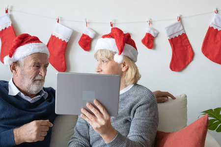 senior elderly caucasian old man and woman, using conference on 