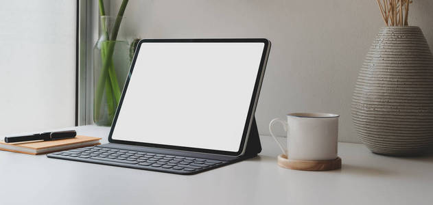 Cropped shot of blank screen digital tablet and  supplies 