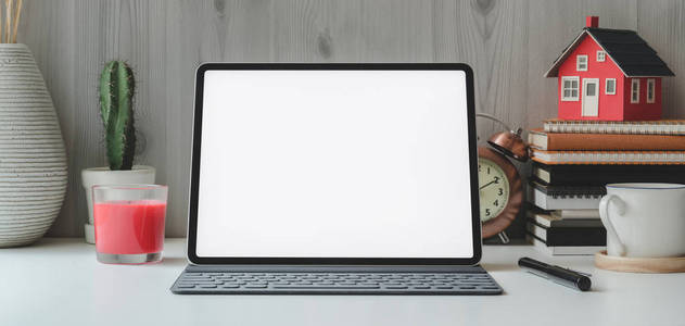 Cropped shot of blank screen digital tablet and  supplies 