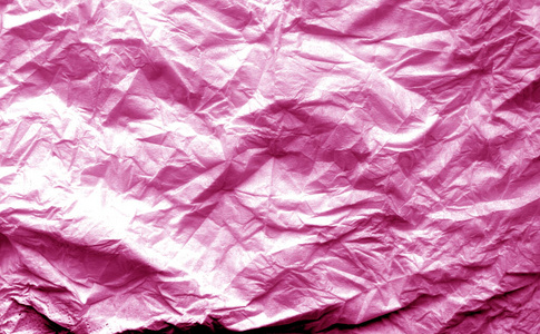 一张皱巴巴的粉红色模糊效果纸。
