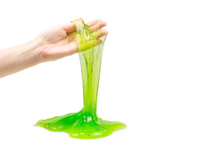 绿色粘液玩具在妇女手隔离白色。