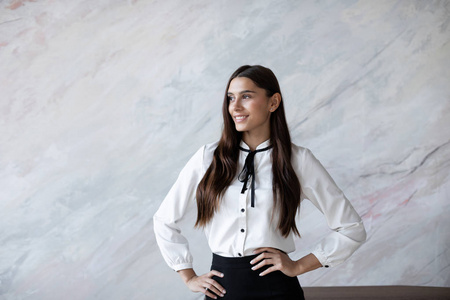 Studio portrait of smiling positive business woman. 