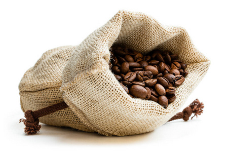 Coffee beans in burlap bag isolated on white 