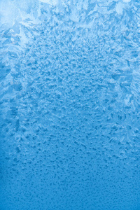 Frozen pattern. Icy water covered with snow crystals. 